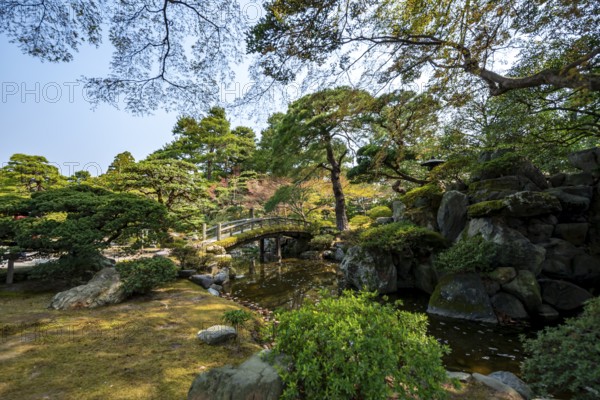 Gonaitei Garden with Dobashi Bridge over a pond, Japanese Garden, Kyoto Imperial Palace, Kyoto, Japan