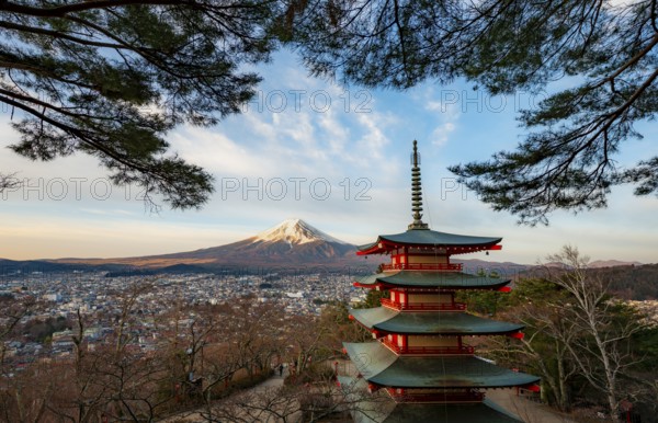 Five-story pagoda of a Shinto Shrine, Chureito Pagoda, with views of Fujiyoshida City and Mount Fuji volcano at sunrise, Arakura Fuji Sengen Shrine, Arakurayama Sengen Park, Yamanashi Prefecture, Japan