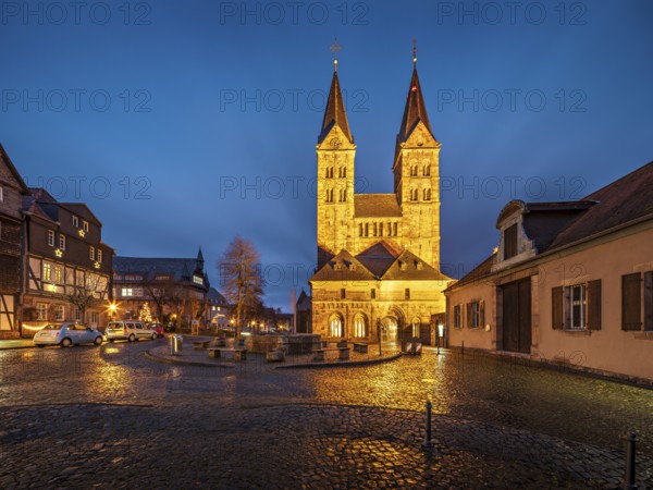The cathedral in the historic old town in the evening, cathedral square with cobblestones, Fritzlar, Hesse, Germany