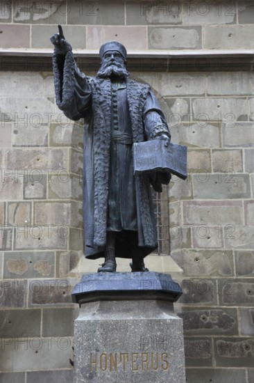 Statue of Johannes Honterus, also Johannes Honter, (born around 1498 in Kronstadt, Transylvania, died 23 January 1549), Transylvanian-Saxon humanist and polymath. As a church reformer, he played a decisive role in the introduction of the Reformation in Transylvania. He was also a schoolman, carver, paper miller and, from 1539, founder and operator of the second, but first permanent and most productive printing works in Transylvania. Statue of Harro Magnussen in front of the Black Church in Brasov, Brasov, Romania