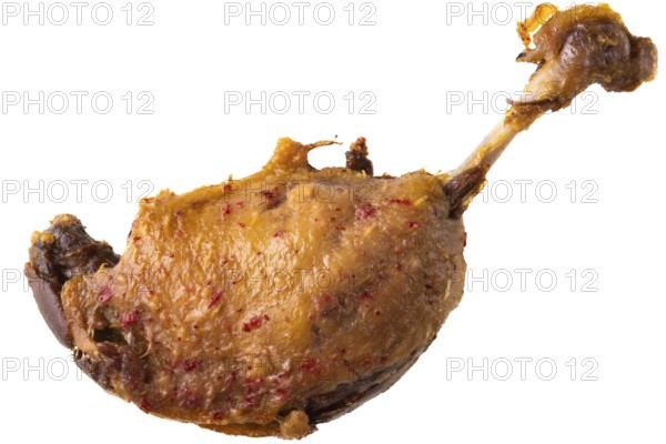 Roasted duck confit isolated. The duck leg is cooked slowly until tender and ready to serve. This dish is traditional in French cuisine