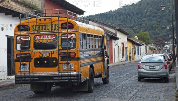 Colorful bus in the old town, former American school bus, Antigua, Sacatepéquez Department, Guatemala