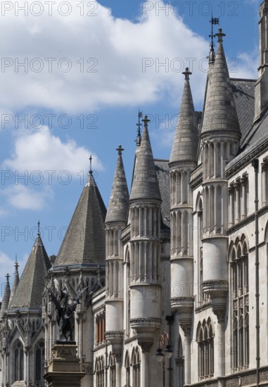 Royal Courts of Justice, neo-gothic architecture with towers under blue sky, London, England, Great Britain