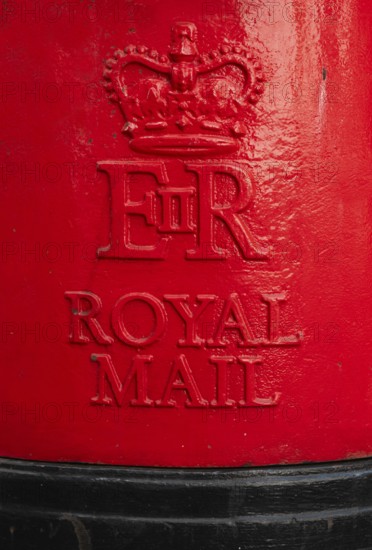 Red Royal Mail mailbox with crown and royal monogram, London, England, Great Britain