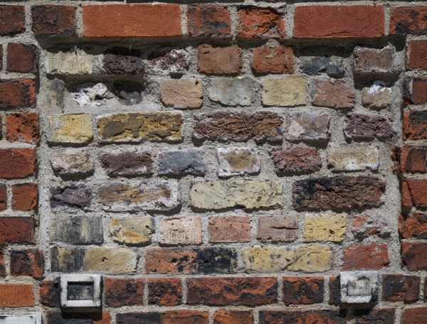Weathered brick wall in various shades and structures, London, England, Great Britain