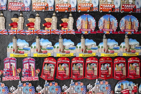 Various colorful London souvenir magnets on a wall, London, England, Great Britain