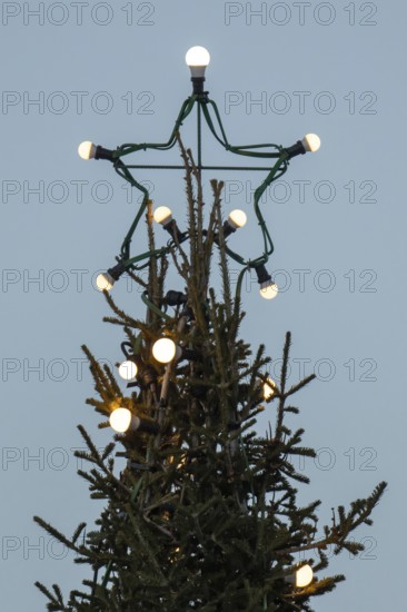Christmas tree illuminated with light bulbs with star tip, Korpoström, Korpo or Korppo, southwestern archipelago, Finland