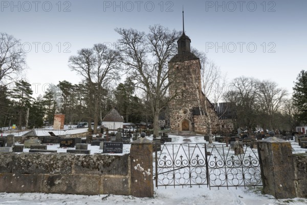 Church building in a snowy cemetery, Korpoström, Korpo or Korppo, southwestern archipelago, Finland
