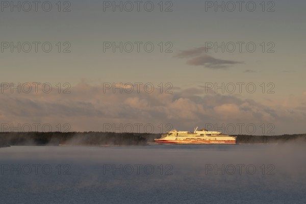 Large Viking Line ferry on calm sea at sunrise, Korpoström, Korpo or Korppo, southwestern archipelago, Finland