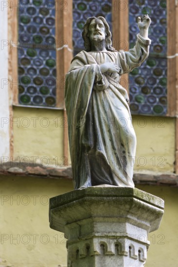 Christ statue in front of the fortified church in Biertan, Romania