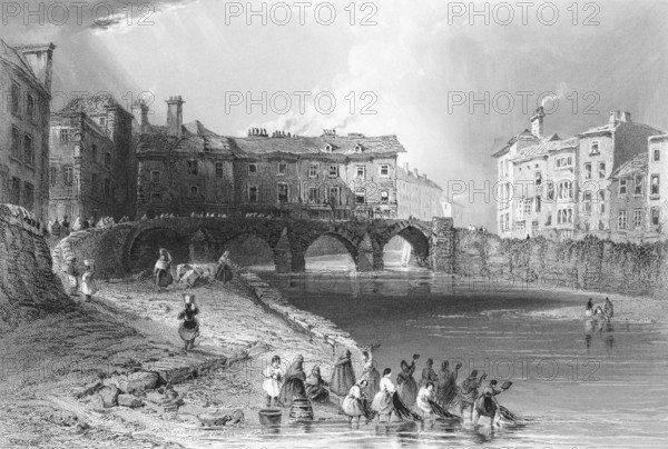 Bridge over the Shannon River in Limerick, woman fishing, Province of Munster, Ireland, city scene, arched bridge, smoking chimneys, row of houses, fortified bank, group of woman, landing net, basket, landmark, steel engraving, 19th century, historical illustration from 1845