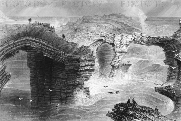 Natural Bridge at Kilkee Cliffside, Nature's Bridge at Kilkee Cliffs, Foohagh, County Clare, Ireland, Atlantic coast, storm, wild water, high waves, rock formations, geology, rock strata, bad weather, seagulls, people, danger, life-threatening, risk, landmark, steel engraving, 19th century, historical illustration from 1845