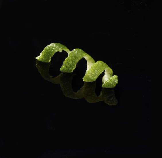 Lime zest against a black background, studio shot