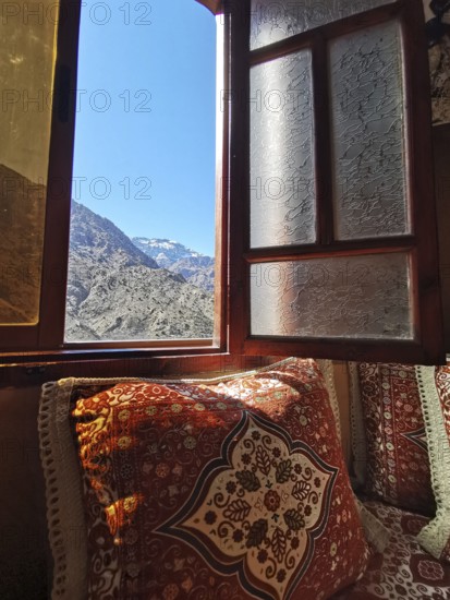 Cozy room with views of clear mountains through an open window, Atlas Mountains, Morocco