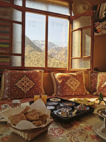 Traditional room with mountain views and breakfast in the warm light of the morning, Atlas Mountains, Morocco