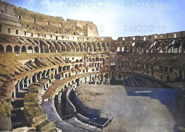 Historical photo (ca 1880) of the Colosseum or Coliseum, also the Flavian Amphitheatre, Amphitheatrum Flavium, Anfiteatro Flavio or Colosseo, an oval amphitheatre in the centre of the city of Rome, Italy / Historical photo of inside if Colosseum or Coliseum, also the Flavian Amphitheatre, Anfiteatro Flavio or Colosseo, an oval amphitheatre in the centre of the city of Rome, Italy, Historical, digitally restored reproduction of an original from the 19th century, exact original date unknown. century, exact original date unknown, subsequently coloured