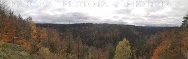 Panoramic view of an autumn forest with hills and cloudy sky, Fichtelgebirge