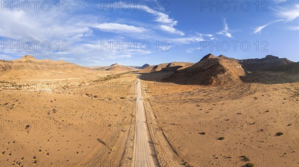 Aerial view, Eternally long straight road, road C14 through the Naukluft Mountains, desert and dry mountains, Namibia