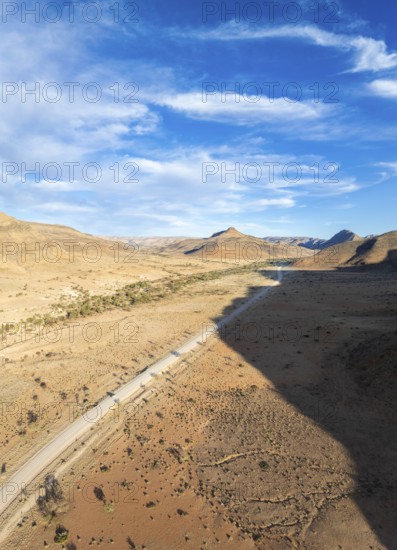 Aerial view, Eternally long straight road, road C14 through the Naukluft Mountains, desert and dry mountains, Namibia