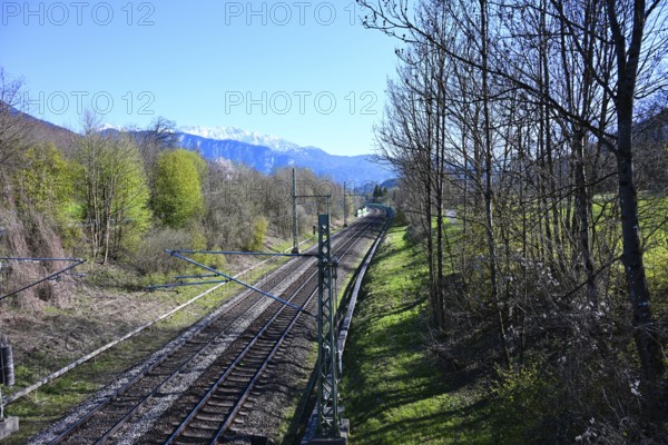 View from a bridge on railroad tracks and the Alps, Oberaudorf, Bavaria, Germany