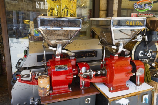 Coffee grinders and beans in a traditional shop, red coffee making machines, Konya, Central Anatolia, Turkey