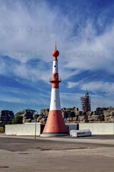 White-red lighthouse under cloudy sky on the coast, The City of Bremen