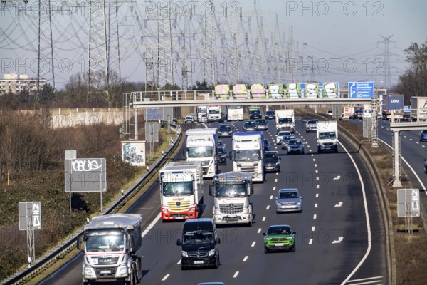 A57 motorway near Kaarst in the Rhein-Kreis Neuss, view towards Kaarst motorway junction, direction Cologne, heavy traffic, overhead line, high-voltage lines, along the motorway, North Rhine-Westphalia, Germany