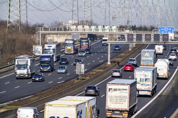 A57 motorway near Kaarst in the Rhein-Kreis Neuss, view towards Kaarst motorway junction, heavy traffic, overhead line, high-voltage lines, along the motorway, North Rhine-Westphalia, Germany