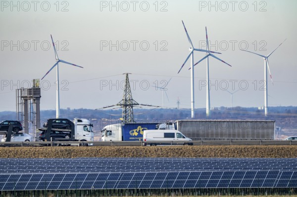 86.5 MW peak open space photovoltaic systems, from RWE, with over 141, 000 solar modules, on a side strip, over 1 km long, along the A44 motorway near Bedburg, at the Jackerath triangle, recultivated open-cast mining site, wind farm north of Titz, North Rhine-Westphalia, Germany