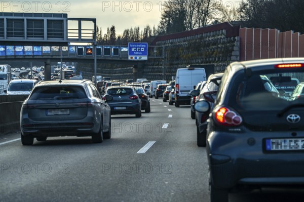 Driving on the A40 motorway, Ruhrschnellweg, in heavy traffic, drivers' perspective, Bochum, North Rhine-Westphalia, Germany