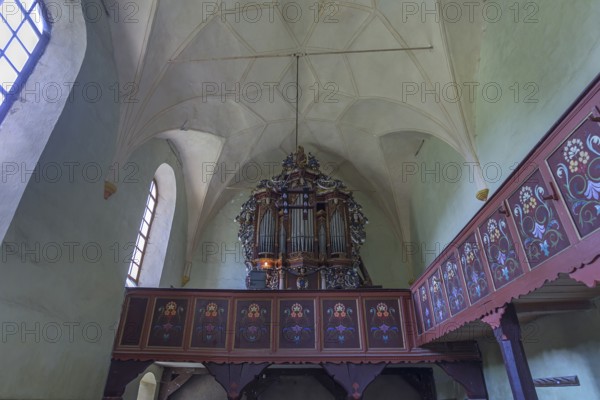 Gallery with baroque organ of the abandoned 16th century Protestant fortified church, Tobsdorf, Romanian Dupus, —Transylvania, Romania