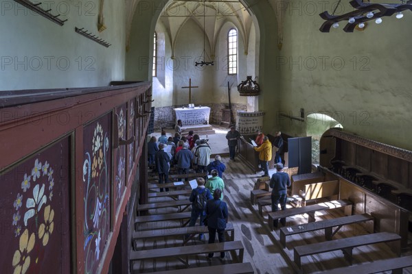 Improvised service in the abandoned church in Tobsdorf, Transylvania, Bulgaria