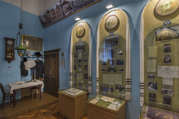 Dining area from a Jewish apartment, showcases with historical photos, Jewish Museum, Czernowicz, Ukraine