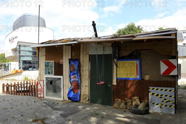 Ahrbnb, an installation by Rocco and his brothers, for the lack of state aid for the victims of the Ahr Valley flood disaster. The hut was built entirely from debris and mud left behind after the devastating flood disaster in the Ahr valley (July 2021), created in 2022, Oldenburg, Lower Saxony, Germany, (permanent artwork in public space)