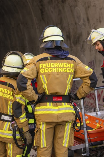 Firefighters in protective clothing prepare for a mission in a tunnel, fire brigade exercise at the Hermann Hesse Railway, Ostelsheim, Calw district, Germany