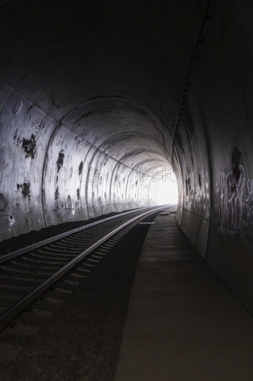 A railway tunnel with a light at the end and dark walls, fire brigade exercise at the Hermann Hesse Railway, Ostelsheim, Calw district, Germany