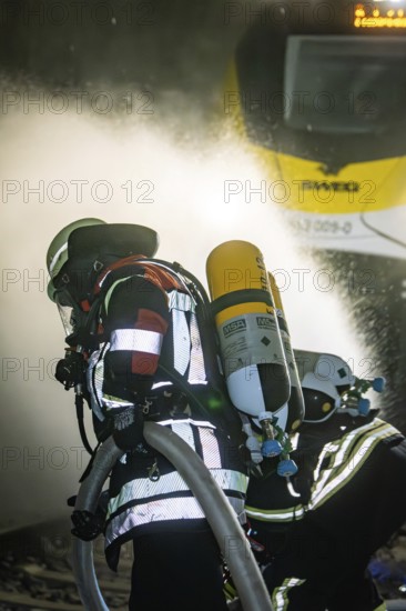 Firefighters work in a tunnel on a train operation, fire brigade exercise on the Hermann Hesse Railway, Ostelsheim, Germany