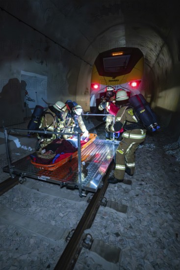 Firefighters carry out a rescue on rails in a tunnel, fire brigade exercise on the Hermann Hesse railway, Ostelsheim, Germany