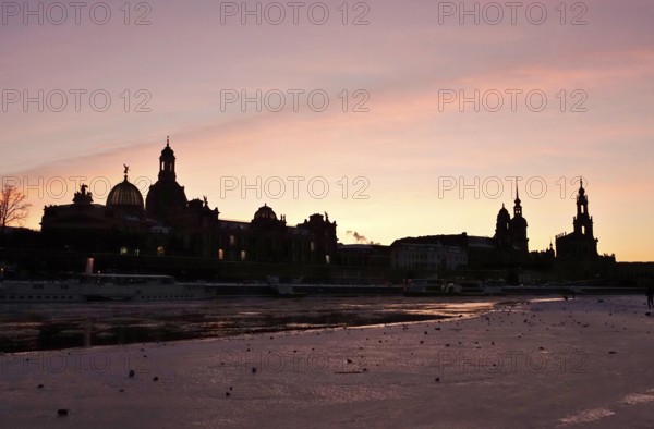 Dresden on a winter evening, Elbe, Church of Our Lady, Palace and Court Church, Saxony, Germany