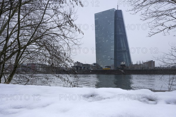 Snow begins to melt on the banks of the River Main in front of the European Central Bank (ECB) in Frankfurt am Main, Frankfurt am Main, Hesse, Germany