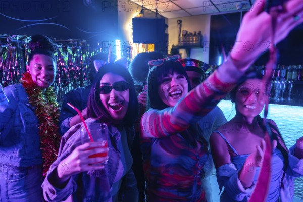 Young diverse friends enjoying a lively nightclub party, smiling, dancing, and posing for a selfie, illuminated by colorful neon lights and creating a festive atmosphere