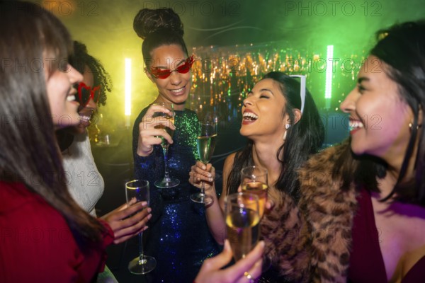 Joyful multiracial women laughing and clinking champagne glasses at a vibrant nightclub party, celebrating friendship, fun and sparkling nightlife together into the evening