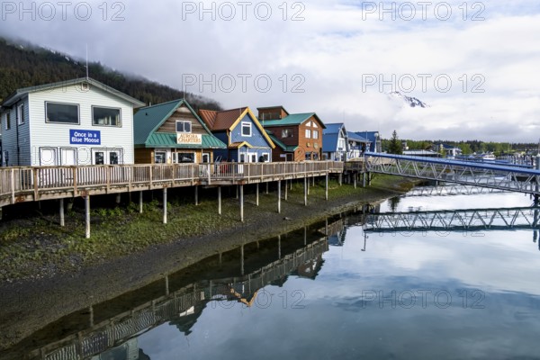 Colourful houses on the harbor, with reflection, Seward, Kenai Peninsula, Alaska, USA