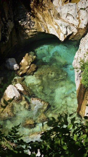 Deep turquoise water in a shady, rocky gorge, Soca Valley, Slovenia