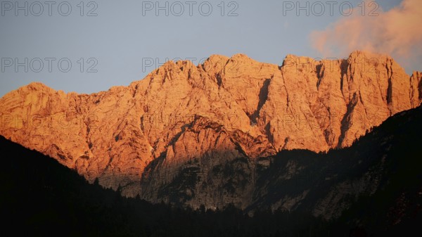 Close-up of mountains at sunset, alpine glow, with gold-lit rocks, Slovenia