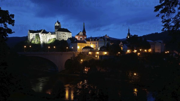 Night view of an illuminated castle and city on a river, Loket, Czech Republic