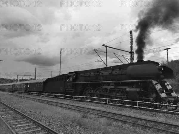 Historic steam locomotive on rails, smoke rises into the sky, Rennsteig, Frankenwald nature park Park