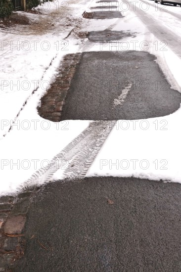 Traces of cars in winter with snow, Germany