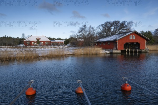 Falunred painted house and boathouse, Korpoström, Korpo or Korppo, southwestern archipelago, Finland