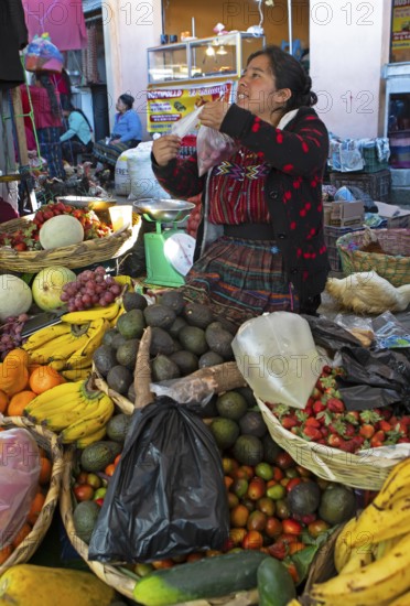 Mayan woman wearing traditional clothes at the market in Sololá, Highlands, Sololá Department, Guatemala